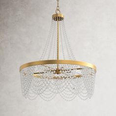 a gold chandelier hanging from a ceiling