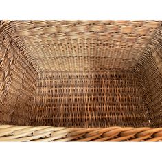 an empty wicker basket sitting on top of a table