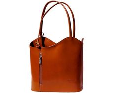 This versatile handbag is unique! It’s simple sleek design is elegant for special occasions or perfect for business. It can be converted to a backpack for a more casual look. Available in rich colors. Stylish Vera Pelle - Genuine Italian Leather - Made in Italy Stamped with "Florence Made in Italy" on front Secure bag with zippered closure, zippered pockets inside and out as well as a zippered section that separates main compartment into 2 spaces Two top handles to carry as shoulder bag or pull Handmade Leather Shoulder Bag, Italian Leather Purse, Italian Handbags, Italian Leather Handbags, Baked Apple, Flap Backpack, Chloe Handbags, Convertible Backpack, Coach Horse And Carriage Tote