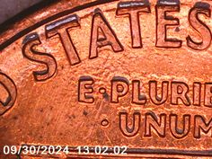 an old rusty metal plate with the words states e - plurie and union on it