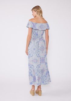 A need-now summer maxi dress, just in time for wedding season! This ultra-dreamy pastel purple maxi dress is designed in a vintage inspired paisley print. Featuring a flowy ruffle-trimmed tiered skirt, on or off-shoulder neckline, flattering ruffle sleeves and a wait accentuating smocked detail. Paisley print Relaxed fit Elastic on or off-shoulder neckline Overlay top Smocked waist Maxi length Ruffle-trimmed skirt Women's flowy bohemian maxi dress Glide into summer in our newest summer silhouette! The soft, flowy fabric offers freedom of movement and a breezy fit, which the convertible on/off-shoulder neckline offers two ways to wear. Whether you're headed to a special summer occasion, a wedding guest, or just headed to the farmer's market, this paisley print boho maxi will have everyone a Elegant Paisley Print Maxi Dress For Vacation, Feminine Flowy Printed Maxi Dress, Flowy Paisley Print Maxi Dress, Flowy Maxi Dress With Paisley Print, Feminine Boho Print Maxi Dress, Spring Paisley Print Maxi Dress, Pastel Maxi Dress, Pastel Maxi Dresses, Summer Silhouette