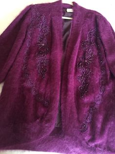 Soft and warm Vintage Angora Sweater Coat with beautiful detailed appliqué open-front  Fully lined with Mirano lining Color: Dark Magenta  34 inches from shoulder to bottom of the sweater/Jacket One size fits most Pockets  No shoulder pads Winter Formal Outerwear With Floral Embroidery, Formal Winter Outerwear With Floral Embroidery, Winter Embellished Long Sleeve Blazer, Formal Fall Outerwear With Floral Embroidery, Formal Floral Embroidered Outerwear For Fall, Winter Embellished Long Sleeve Outerwear, Embellished Long Sleeve Outerwear For Fall, Winter Embellished Long Sleeve Cardigan, Elegant Winter Outerwear With Floral Embroidery