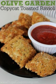 some fried ravioli on a plate with sauce in a bowl and the words olive garden copycat toasted ravioli