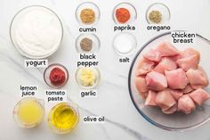 ingredients to make chicken broth laid out on a white marble counter top with text