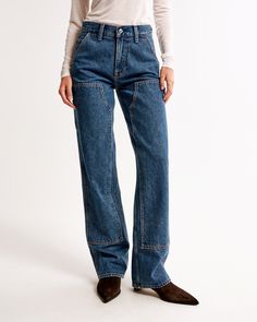 Our new classic mid rise slouchy jeans in a dark wash, with carpenter details and a clean hem. This fit features a 9.5” mid rise, is slouchy at the waist and hips, and eases through the thigh into a baggy, full-length leg shape. We recommend buying your true size for a slouchier fit. Size down for a closer fit. This jean is made from our heavyweight rigid denim, a super soft authentic cotton fabric with no stretch. Fall Denim Bottoms With Contrast Stitching, Denim Bottoms With Contrast Stitching For Fall, Relaxed Fit Denim Flare Jeans With Contrast Stitching, Dark Wash Mid-rise Bottoms With Contrast Stitching, Mid-rise Dark Wash Bottoms With Contrast Stitching, Dark Wash Rigid Denim Cargo Jeans With Contrast Stitching, Dark Wash Cargo Jeans With Contrast Stitching, Cargo Jeans In Dark Wash With Contrast Stitching, Utility Denim Jeans With Contrast Stitching