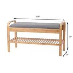 a wooden bench with a gray cushion on it