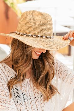 The cowboy hat you have all been waiting for is here... The Coastal Cowgirl Hat is promised to add that beachy-western edge to every look you're planning this summer. This straw hat is perfect for hot summer concerts, or laying out by the pool. Style with your favorite cowboy boots and just about ANY dress for that dream western outfit you've been craving. 100% braided Raffia with shell band Crushable, packable, travel-friendly Adjustable inner drawstring for the perfect fit Summer Beach Brimmed Sun Hat, Summer Beach Hat With Curved Brim, Summer Beach Sun Hat With Curved Brim, Coastal Style Sun Hat For Summer Vacation, Curved Brim Sun Hat For Summer Beach, Adjustable Flat Brim Fedora For Beach, Curved Brim Summer Beach Sun Hat, Brimmed Beach Hat For Vacation, Coastal Beach Hats With Uv Protection