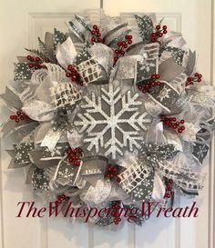 a christmas wreath hanging on the front door