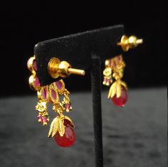 "These Earrings set has an excellent finish and gives out an exquisite sense of style. If you are looking for an amazing Fashion Jewelry set for special occasions such as Anniversary, Engagement, Party, Wedding, or for gifting, then your search ends here. Handmade Indian Temple Jewelry, best to wear it for traditional ceremonies or Indian wedding. This bridal jewelry has an ethnic finish. It has Cubic Zircon stones with semi-precious ruby and emeralds. It is a Bollywood style one gram jewelry. T Festive Yellow Gold Jewelry Sets With Matching Earrings, Gold Temple Jewelry Bridal Earrings For Party, Gold Temple Bridal Earrings For Party, Formal Jewelry Sets With Matching Earrings For Festivals, Formal Jewelry Sets With Matching Earrings, Gold Ruby Earrings For Celebration, Ruby Gold Drop Danglers, Gold Ruby Danglers For Celebration, Gold Ruby Earrings For Festivals