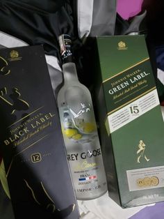 a bottle of booze next to an open box