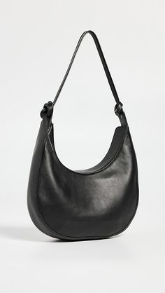 Reformation Medium Rosetta Shoulder Bag | Shopbop Chic Leather Shoulder Bag With Round Handle, Leather Bags With Adjustable Strap And Round Handle, Elegant Leather Shoulder Bag With Arcuate Strap, Leather Hobo Bag With Adjustable Strap And Round Handle, Modern Bags With Arcuate Shoulder Strap For Everyday Use, Black Rectangular Shoulder Bag With Arcuate Strap, Leather Shoulder Bag With Arcuate Strap For Travel, Ugg Tasman Outfit, Ugg Tasman Slippers Outfit