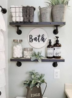 a bathroom with two shelves above the toilet and some plants on the shelf below it