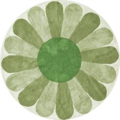 a round rug with green and white flowers on it