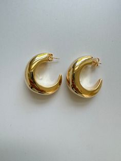 Half Moon Hoops. Elegant statement hoops. Lightweight with hollow interior. Very comfortable. Posts. Earrings measures approximately 1.50” 18kt Gold filled 1/2” wide Gold Crescent Hoop Earrings For Everyday, Everyday Gold Crescent Hoop Earrings, Elegant Gold Half Moon Hoop Earrings, Elegant Half Moon Gold Hoop Earrings, Modern Crescent Hoop Earrings, Pierced, Modern Crescent Hoop Earrings, Modern Crescent Shaped Pierced Hoop Earrings, Modern Gold Crescent Hoop Earrings, Modern Gold Crescent Earrings