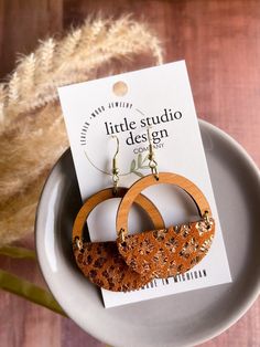 New Design from Little Studio Design Co! Gorgeous Ginger Leopard Suede Hoop Earrings! Lightweight and full of style! Perfect for everyday or something extra! Beautiful cherry wood arch paired with a Ginger Leopard Suede Leather! Beautiful russet colored leather with a gold metallic leopard print.  These earrings are beautiful! *Nickel free Earwire *Handmade in Michigan *1.5in diameter Thank you so much for supporting our shop! We love your support and your referrals! Brown Hoop Earrings With Ear Wire For Gift, Brown Single Hoop Earring As Gift, Brown Small Hoop Earrings As Gift, Brown Hoop Earrings Gift, Brown Small Hoop Earrings With Ear Wire, Nickel-free Brown Hoop Earrings As Gift, Brown Hoop Earrings With Ear Wire, Brown Round Hoop Earrings For Gift, Brown Circular Earrings For Gifts