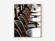 a row of tables and chairs sitting next to each other