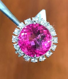 Gorgeous Rubelite & Diamonds Ring -Natural gemstone - Natural color - Rubelite- 6.95 cts Stone Origin: Brazil-Grade:AAA Purity: Very Good Color: Bright Medium Pink  Top quality Diamonds-Carats: 1.03 cts Color - E-F Color-Purity- VS1-2 Ring size: 6.25  Metal: 18K White Gold 7.04 gr This Ring has an Unique Pink color - very bright - quite RARE for Rubelite This ring will cost at least 6.5-7K on a shop  Layaway is an option  Ref: ATRS All 18K-14K Gold items will be shipped with UPS. fully insured. Exquisite Gia Certified Round Gemstones, Exquisite Gia Certified Gemstones, Pink Round Gemstones With Prong Setting, Gia Certified Dazzling Gemstones For Gift, Gold Items, Pink Top, Quality Diamonds, Pink Tops, Natural Color