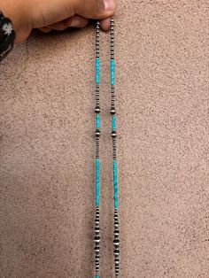 Experience the beauty and craftsmanship of authentic Native American jewelry with our 60" Wrap Around Turquoise and Pearls Necklace. Each piece is meticulously strung by hand by Navajo artist Lucinda Sardo, showcasing stunning pearls and vibrant turquoise. Enhance any outfit with this versatile and timeless piece. Traditional Turquoise Single Strand Jewelry, Traditional Turquoise Beaded Necklace With Spacer Beads, Traditional Turquoise Beaded Necklaces With Spacer Beads, Traditional Turquoise Jewelry, Traditional Turquoise Single Strand Necklace With Round Beads, Traditional Turquoise Single Strand Beaded Necklace, Traditional Turquoise Single Strand Beaded Necklaces, Traditional Blue Turquoise Single Strand Necklace, Blue Lariat Jewelry Hand-strung