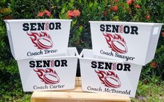 three signs that say senior, coach and senior