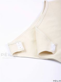 Peilia - Chic Spaghetti Strap Sleeveless Bodysuit - Elegant Slim Fit Womens Apparel Cream Sleeveless Bodysuit For The Beach, White Sleeveless Shapewear Camisole, White Sleeveless Lined Camisole, Stretch Seamless Camisole Bodysuit, White Lined Sleeveless Camisole, White Sleeveless Bodysuit With Adjustable Straps, Elegant Stretch Push-up Bodysuit, Sleeveless Stretch Bodysuit With Built-in Bra, Sleeveless Beige Lined Bodysuit