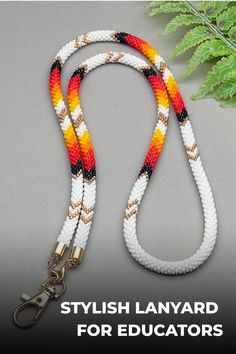 Elevate your professional style with this meticulously crafted white and orange teacher lanyard. Handcrafted using premium Japanese seed beads, this lanyard ensures durability and elegance. Ideal for securely carrying keys, ID cards, and badges with a touch of sophistication. Experience the perfect blend of functionality and fashion with this exceptional accessory that complements your daily essentials seamlessly. Elevate your everyday routine effortlessly with this stylish lanyard in hand! Beaded Lanyard, Teacher Lanyard, Professional Style, Everyday Routine, Beaded Lanyards, Snake Bracelet, White And Orange, Snake Necklace, Handmade Beaded Jewelry