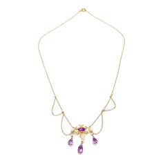 A fine Edwardian style festoon necklace.  In 14 karat yellow gold.  Centered on an ornate gold yolk with a bezel-set oval-cut amethyst.   Supporting 3 drops with freshwater river pearls and briolette-cut amethysts and flanked by several festooned swags punctuated by pearl mounts to the chain.  Simply a wonderful, delicate festoon necklace!  Date:  20th Century  Overall Condition: It is in overall good, as-pictured, used estate condition with some fine & light surface scratches and other signs of expected light wear consistent with age.  Fineness: Marked 14k for gold fineness.   Marks: Marked 14 to the clasp.  Gemstone Measurements: Amethyst cabochon: ca. 6.5 x 4.23 x  3.27 mm Largest Amethyst Drop: Length: ca. 9.5 mm Diam: ca. 5.2 mm  Measurements: Chain Length: ca. 16 in. Pendant: Height: Yellow Gold Oval Necklaces Art Nouveau Style, Art Nouveau Yellow Gold Oval Necklace, Antique Oval Purple Necklaces, Antique Purple Oval Necklaces, Yellow Gold Amethyst Necklace For Wedding, Art Nouveau Yellow Gold Gemstone Necklaces, Purple Victorian Oval Necklace, 14k Gold Oval Necklace In Purple, Victorian Amethyst Oval Necklaces