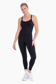 Be ready for your next workout in our Full Length Seamless Micro-Ribbed Jumpsuit! This comfy, 4-way stretch unitard is made for a sculpted look and adjustable straps to ensure your perfect fit. Look and feel great - from studio to street - with this trending style! This jumpsuit is true to size. Kortney is wearing her true to size medium. Product Details: -94% Nylon / 6% Spandex Sizing: S/M: 2-8 M/L: 8-12 High Stretch Sports Unitard With Built-in Bra, Seamless Compression Unitard For Yoga, High Stretch Unitard With Built-in Bra For Workout, Seamless Stretch Unitard For Gym, Solid Compression Nylon Unitard, Compressive Athleisure Unitard With Built-in Bra, High Stretch Yoga Unitard With Built-in Bra, High Stretch Unitard With Built-in Bra For Yoga, Compressive Seamless Solid Color Unitard