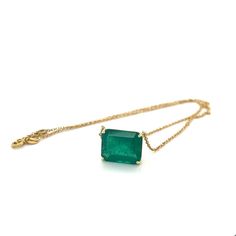 Introducing this Vivid Green Colombian Emerald connecting choker necklace set in 18k solid yellow gold. The pendant seamlessly integrates with the cable chain in what's known as a 'floating' solitaire pendant necklace. The chain necklace features 2 closure holes that allow for an adjustable length on the neck.   This gem displays a very fine, richly saturated vivid green color that is representative of top-quality emeralds. Finely cut to enhance the overall visual appeal and optimize color refraction. Fine quality emeralds in excess of 8 carats are quite rare, and the combination of origin and quality elements for this emerald signifies a gemstone worthy of distinction.   Stationed on an elegant 4-prong basket solitaire mounting. Stamped '750' on the clasp. Video Link: https://youtube.com/ Elegant Yellow Gold Emerald Necklace With Adjustable Chain, Formal Solitaire Necklace With Cable Chain, Solitaire Diamond Necklace, Chanel Flower, Vintage Beads Necklace, Peridot Necklace, Heart Necklace Diamond, Solitaire Pendant Necklace, Diamond Solitaire Necklace