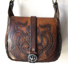 "Beautiful Vintage 60s or 70s Saddle Leather Handbag Purse Great Vintage Condition with Amazing Patina - unique hardware, and leather stitching, inside leather pocket Rough Measurements: Width: 10 1/2\" Length (the bag itself not including strap or ring handles): 9\" Depth (slightly Stretched): 4\" Will ship out between 1-3 business days once the payment has been made. Please message me w/ any questions. All sales final. And please check out my other vintage shirts!! thank you!" Retro Leather Flap Bag For Daily Use, Retro Vintage Brown Leather Bags, Vintage Brown Hand-tooled Travel Shoulder Bag, Vintage Brown Hand Tooled Bag For Travel, Hand Tooled Vintage Brown Travel Shoulder Bag, Vintage Satchel Flap Bag For Daily Use, Retro Leather Flap Bag For Everyday Use, Vintage Hand Tooled Tote Satchel, Vintage Brown Hand Tooled Bag For Everyday Use