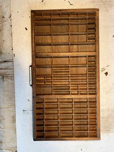 an old window with wooden slats on it