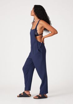 An oversize sleeveless lounge jumpsuit designed in soft cotton gauze. Cotton gauze Relaxed, oversize fit Sleeveless Long straight leg Racerback Side pockets Adjustable button straps Bohemian lounge jumpsuit Effortlessly cool and casual, our overalls-style jumpsuit is designed in soft cotton gauze. With a racerback detail and adjustable button straps. Perfect for lounging or running errands, we love to style it over a simple camisole tank top. Model is 5'9, wearing a size S.Style: I-73216W-RJZ Sleeveless Cotton Jumpsuits And Rompers For Loungewear, Cotton Sleeveless Jumpsuits And Rompers For Loungewear, Relaxed Sleeveless Loungewear Jumpsuit, Sleeveless Solid Color Overalls For Loungewear, Sleeveless Overalls For Loungewear, Relaxed Cotton Jumpsuits And Rompers For Lounging, Cotton Wide-leg Jumpsuits And Rompers For Loungewear, Cotton Wide Leg Jumpsuits And Rompers For Loungewear, Relaxed Fit Sleeveless Jumpsuits For Loungewear