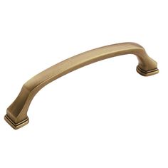 an antique brass pull handle on a white background