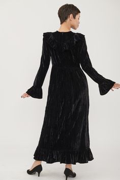 NOTE: This is a Sale Item and is non-refundable. Eligible for Exchange or Store Credit Only. Details Our bestselling dress is made in black crushed velvet and is fitted at the bodice, with a V-shaped ruffle and a full skirt and ruffles at the sleeves and bottom hem Content + Care 100% Polyester Dry clean only Made in India Fit Model wears a size 2 and is 5'9" Fits true to size Size 2 measurements Bust: 35" Waist: 29" Length from shoulder: 52 1/2" Size 10 measurements Bust: 40" Waist: 33" Length Caroline Dress, Brand Collection, Crushed Velvet, Laura Ashley, Dress 100, Full Skirt, V Shape, Size Guide, Ruffles