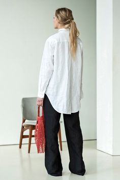 "White linen shirt. The classic collared linen blouse is perfect for the upcoming spring days. It's simplicity really is the key: it gives you the room for pairing it with anything - skirts, pants, shorts, flats, heels, espadrilles... you name it. Leave it out or tuck it inside, wear it to work or to the beach over your bathing suit - it will be you're got to shirt for all warm season and perfect for layering in colder weather. ABOUT US LINEN ID was born from desire to embrace things that actual Oversized Linen Blouse With Button Closure, Linen Shirt With Button Cuffs And Shirttail Hem, Oversized Linen Button-up Blouse, Classic Oversized Linen Blouse, Oversized Linen Collared Blouse, Oversized Linen Collared Shirt, Oversized Linen Shirt With Button Closure, Fall Linen Blouse With Shirttail Hem, Linen Shirt With Roll-up Sleeves For Daywear