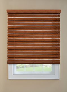 a window with wooden blinds in a room