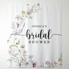 a floral bridal shower sign hanging on the wall