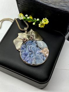 "Artisan Rainbow Druzy pendant comes with 20\" silver chain Hand-made Sterling Silver 925. Stones used: Rainbow Druzy, Pink Tourmaline. Height -2 1/2\" (including bail), Width - 1 3/4\" Height - 65mm (including bail), Width - 45mm Unique Handcrafted One-of a-kind Design Pendant Each Piece of Jewelry in my Collection is Absolutely One of a Kind! When you start wearing a piece of my jewelry you will fall in love with it more and more each day and feel that good Energy and Love that I pass into it Round Amulet Crystal Necklace Gift, Amulet Style Round Crystal Necklaces For Gifts, Amulet Style Round Crystal Necklace Gift, Round Amulet Crystal Necklace As Gift, Round Mineral Crystal Necklaces For Gifts, Silver Oval Pendant Crystal Necklace For Gift, Gift Necklace With Large Round Stone, Sterling Silver Jewelry With Large Healing Pendant, Sterling Silver Pendant Crystal Necklace For Her