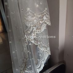 Beautiful embroidered dupatta with scallop border. Perfect for your wedding veil. It is very rich and classy dupatta. More dupatta here in our collection https://www.etsy.com/shop/neelcreations/?section_id=15880219 This Bridal Dupatta is embroidered on net with beautiful Scallop border. This can be your wedding dress chunni for Indian occasion wear for festival. This has perfect bling for you to look classy and ethnic at same time. NOTE : There might be slight color variation due to different co Wedding Dupatta With Intricate Embroidery For Anarkali, Wedding Organza Dupatta Unstitched, Wedding Unstitched Organza Dupatta, Wedding Sharara In Net Fabric, Unstitched Dupatta With Intricate Embroidery For Wedding, Sheer Organza Dupatta For Reception, Wedding Organza Dupatta, Net Sharara For Wedding And Eid, Wedding Resham Embroidered Chanderi Dupatta