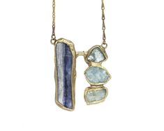 Inspired from the hues, texture and movement of a waterfall, blue kyanite and aquamarine are embedded in brass anchored on our signature brass cuff with a handmade clasp. Pendant Length 1 1/2" Width 1 1/2" Chain Length 16" - 18" This piece is handmade-to-order, please allow 1 - 2 weeks to ship unless this piece is in stock. Each piece will vary slightly due to the uniqueness of the stones. All metal is nickel free. Blue Hand Forged Jewelry For Healing, Unique Blue Brass Jewelry, Spiritual Blue Hand Forged Necklace, Unique Blue Necklace With Patina, Waterfall Necklace, Brass Cuff, Blue Kyanite, Brass Chain, Aquamarine