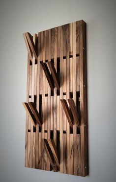 a piece of wood that has been made into a wall hanging on the side of a wall