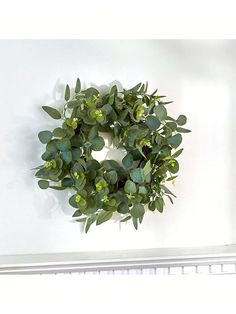 a green wreath hanging on the wall