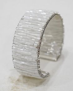 "This is a wonderful Silver and White Glass Beaded Cuff Bracelet that is Adjustable. A fun beaded bracelet which sparkles in a vibrant white color and would make great gifts for special occasions or Holidays or just great to wear to complete your wardrobe. RADIUS WILL CHANGE DUE TO BEING ADJUSTABLE 4\" wide 4\" radius AT BACARA WE STAND BEHIND ALL OF OUR MERCHANDISE. FULL MONEY BACK GUARANTEE WILL BE PROVIDED FOR DISSATISFIED CUSTOMERS. YOUR SATISFACTION IS OUR MAIN GOAL, AND WE THANK YOU FOR SH Native Bracelets, Native Beading, Native Beading Patterns, Turtle Bracelet, Beaded Cuff Bracelet, Beaded Cuff, Minimalist Bracelet, Bracelet Beaded, Jewelry Making Tutorials