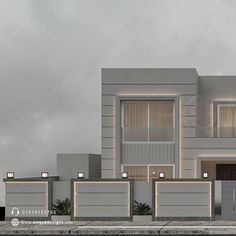 a modern house with two garages and lights on the front