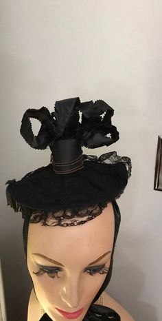 Amazing Funeral Millinery from the Edwardian era. In good vintage condition for its age, lace is a bit distressed but the hat is so amazing, who would notice. Perfect for theatre or movie costume shops or collectors of macabre Millinery. Feel free to convo me with any further questions. Thank you for your interest. Vintage Black High Crown Costume Hat, Vintage Distressed Black Hat, Vintage Black Fascinator, Vintage Black Hat With Feathers, Vintage Black Hat Headpiece, Santa Boots, Salty Dog, Leather Coin Purse, Metal Trim