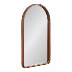 an arched wooden mirror on a white background