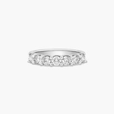 a white gold wedding band with five diamonds