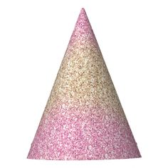 a pink and gold glitter party hat on a white background