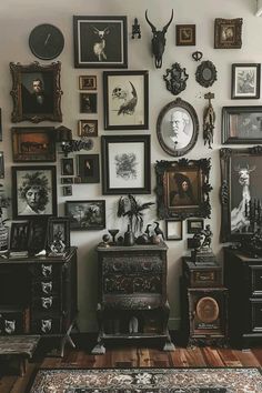 there are many framed pictures on the wall