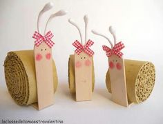 three small cardboard reindeers with bows on their heads