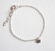 This cute and minimalist silver star bracelet would be a precious gift for a new baby, first birthday, baptism, children gift, or any occasions. This tiny & adorable bracelet is made with sterling silver chain adorned with one tiny Silver Star. ➵ The bracelet size is adjustable thanks to 3 cm extender chain, but if you need personalised size just ask me for this option when you order. ➵ All childrens jewels: https://www.etsy.com/shop/silverbirdjewels?ref=seller-platform-mcnav&section_id= Dainty Sterling Silver Bracelet With Star Charm, Minimalist Bracelets With Star Charm, Silver Star Bracelets For Everyday, Minimalist Bracelet With Star Charm For Gift, Minimalist Bracelets With Star Charm For Gift, Minimalist Bracelet With Star Charm As Gift, Sterling Silver Bracelets With Star Charm As A Gift, Minimalist Star Charm Bracelet As Gift, Dainty Silver Bracelet With Star Charm